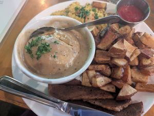 Watercourse platter with seitan bacon and biscuit and gravy at Watercourse Foods in Denver