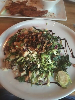 Brussel Sprout Salad w/ Seitan Wings hiding in the background  at Watercourse Foods in Denver