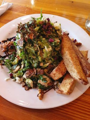Mouthwatering kale and brusselsprouts salad with seitan at Watercourse Foods in Denver