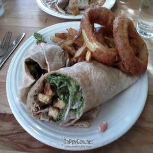 Blackened Tofu Caesar Wrap with Onion Rings and Fries at Watercourse Foods in Denver