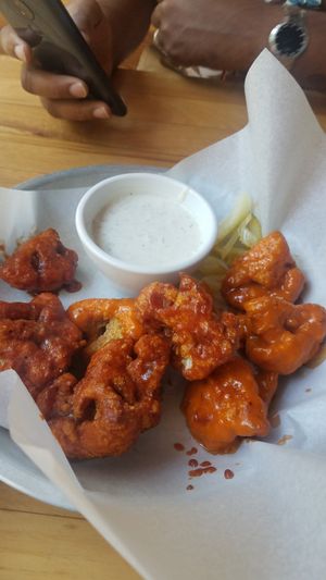 1/2 and 1/2 cauliflower buffalo wings at Watercourse Foods in Denver