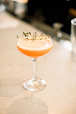 The carrot cocktail is made with Benham's Sonoma Gin, turmeric and cumin at Sow Plated in Upper Arlington