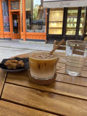 iced latte with oat milk and a vegan chocolate chip cookie at Melt Cafe in Zagreb