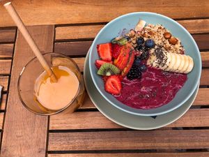 Smoothie bowl and fresh orange juice.  at Melt Cafe in Zagreb