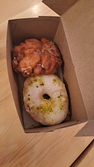 apple fritter and pistachio rose donut at bloomer's in Toronto