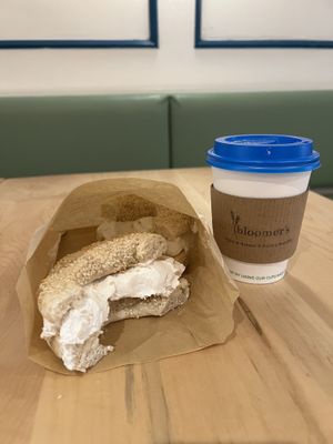Sesame bagel with house made “cream cheese” and a latte   at bloomer's in Toronto