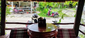 Floor seating overlooking road at Two Sister  in Koh Samui