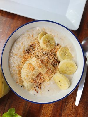 Coconut Milk Oatmeal with Quinoa, Banana and roasted Coconut at Two Sister  in Koh Samui