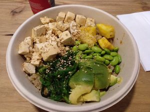 Quinoa + tofu + avocado + seaweed + pineapple + edemame  at Poke & Greens in Madrid