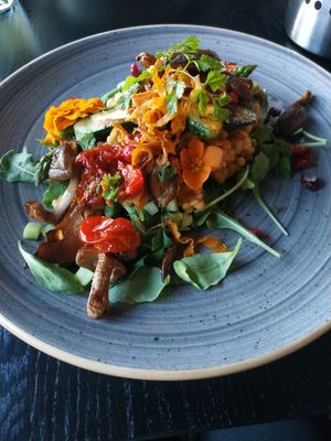 Pepite in oven baked tomato sauce with a side of panfried zucchini, asparagus, shiitake mushrooms and leek at Kivi Paber Käärid in Tallinn