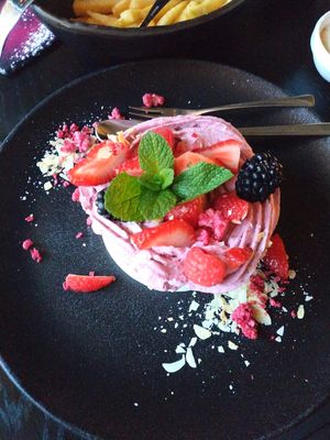 Vegan Pavlova with Fresh Berries and Dewberry Cream at Kivi Paber Käärid in Tallinn