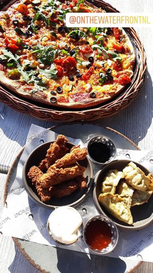 Sicilian pizza, southern fried chkn bites and crispy veg parcels  at On The Waterfront in Exeter