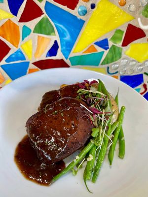 This was on a special holiday menu. Meati Steak with a Vegan/Organic Red Wine Sauce, New Potatoes and Green Beans Vegan & GF.  at Vin'tij in Miramar Beach