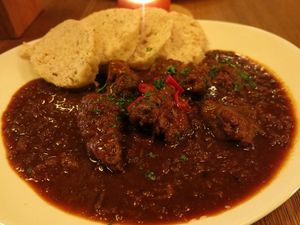 A Czech special: Spicy goulash with vegetarian “meat” pieces, served with wholemeal dumplings/or baked potatoes  at Maitrea in Prague