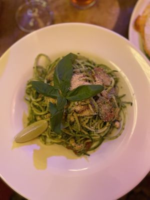Raw courgette spaghetti with basil pesto, tomatoes, and vegan Parmesan  at Maitrea in Prague