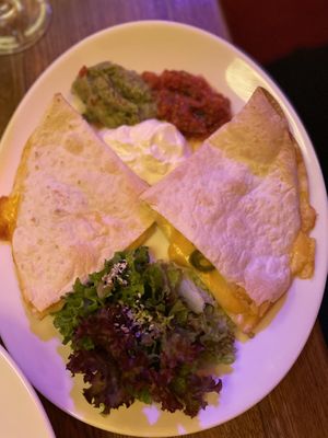 Vegan quesadillas with vegan creme, tomato sauce and guac  at Maitrea in Prague
