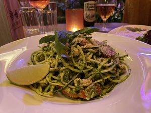 Raw courgette spaghetti with basil pesto, tomatoes, and vegan Parmesan  at Maitrea in Prague