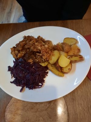 Seitan with onions red cabbage and potatoes at Maitrea in Prague