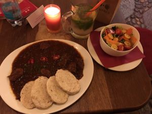 Goulash with dumplings; side salad and handmade lemonade.  at Maitrea in Prague