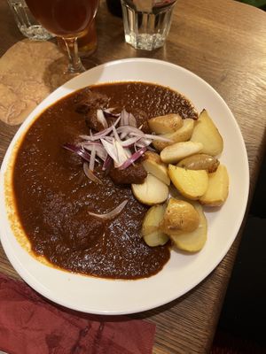 Goulash with potatoes (bread dumplings are not vegan)  at Maitrea in Prague