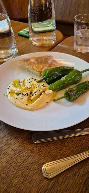 Appetizer - Hummus with Padron peppers and bread at Maitrea in Prague