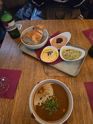 Selection of appetizers with bread at Maitrea in Prague