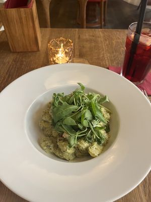 Gnocchi with basil sauce, dried tomatoes and arugula.   at Maitrea in Prague