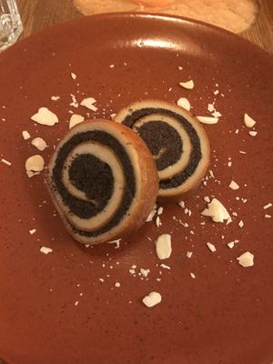 Raw poppy seed scroll dessert at Maitrea in Prague