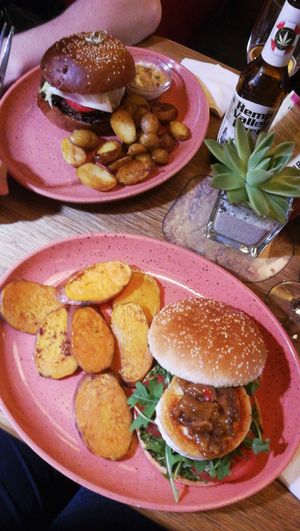 Vegan BBQ left, goat cheese burger with mango chutney right at Maitrea in Prague
