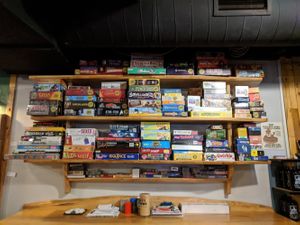 One section of their board games at One Well Brewing in Kalamazoo