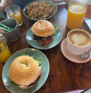 (Left to right) the pineapple and mango lemonade, the ham bagel, the oyster bagel, the kimchi bowl, the caffe latte  at Avocado Spot in Gdansk