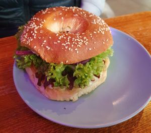 Vegan "pulled pork" bagel with jackfruit fried in bbq sauce, carrot and red cabbage slaw, lettuce, pickled cucumber, and balsamic cream at Avocado Spot in Gdansk