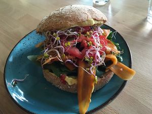 Rye bagel with carrot salmon at Avocado Spot in Gdansk