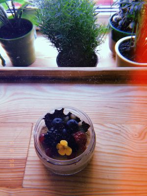 So delicious vegan dessert! With peanuts, fruits and real flowers !  at Planta Bistro in Poznan