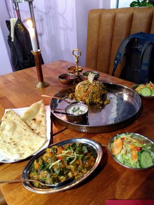 Vegan okra stew, garlic naan, mixed rice stew at Mantra Restaurant in Berlin