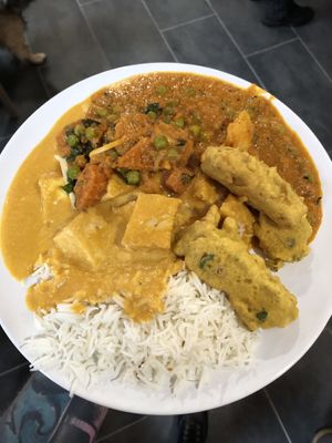 Two curries on rice, plus samosas   at Mantra Restaurant in Berlin