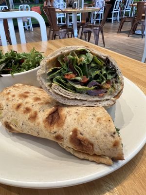Mediterranean Wrap- hummus, spicy herb sauce, red pepper pistachio spread, cucumber, olives, artichoke, organic spring mix, lemon oregano vinaigrette  at True Food Kitchen in Jacksonville