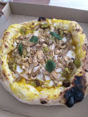 Pumpkin & wild garlic: with pumpkin cream, homemade cashew mozzarella, wild garlic burger chunks, oyster mushrooms & fresh basil at Plant A Pizza in Ghent