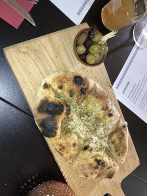 Cheesy garlic bread & olives  at Plant A Pizza in Ghent