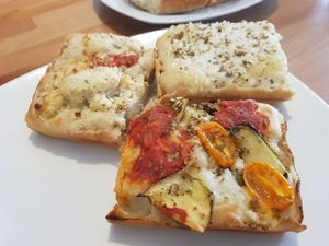 Quarters of different pizzas - Detroit style at Plant A Pizza in Ghent