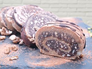 Raw Walnuts Rolls - a delicious and soft cover made from almond and oatmeal flakes, filled with walnuts, hazelnuts, cocoa butter, coconut oil, cinnamon at Raw Bakery in Bucharest
