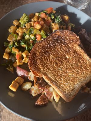 Tofu scramble with potatoes and toast   at Oaks Eatery in Three Oaks