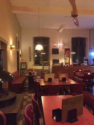 Nice retro interior with fireplace at Café Modern in Voeren