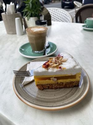 Cake & flat white with oat milk  at Home of Franziska in Budapest
