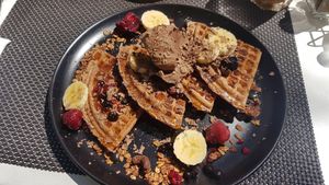 Blueberry waffle with chocolate ice cream and fruit 😍 at Plantd in Windhoek
