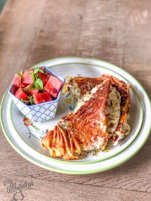 Cheese In Love With Sun-dried Tomatoes Sandwich, with a side watermelon salad at Pilgrim in Kampot