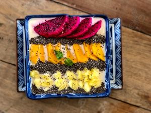 Tropical Chilled Oatmeal. Soaked overnight in coconut milk, topped with fresh fruit & chia seeds at Pilgrim in Kampot