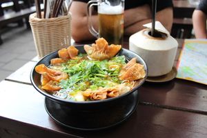 noodle soup with wantan and a fresh coconut  at Eden in Berlin