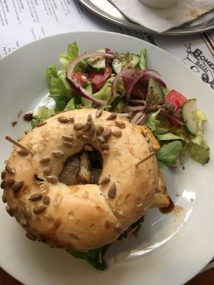 Really nice tofu burger with pineapple  in a bagel and salad at Bohemia Bagel in Prague
