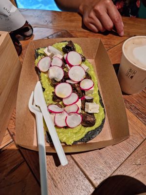 Charcoal infused bread with avocado, raddish and mushrooms at Base V Juicery - Via dei Neri in Florence